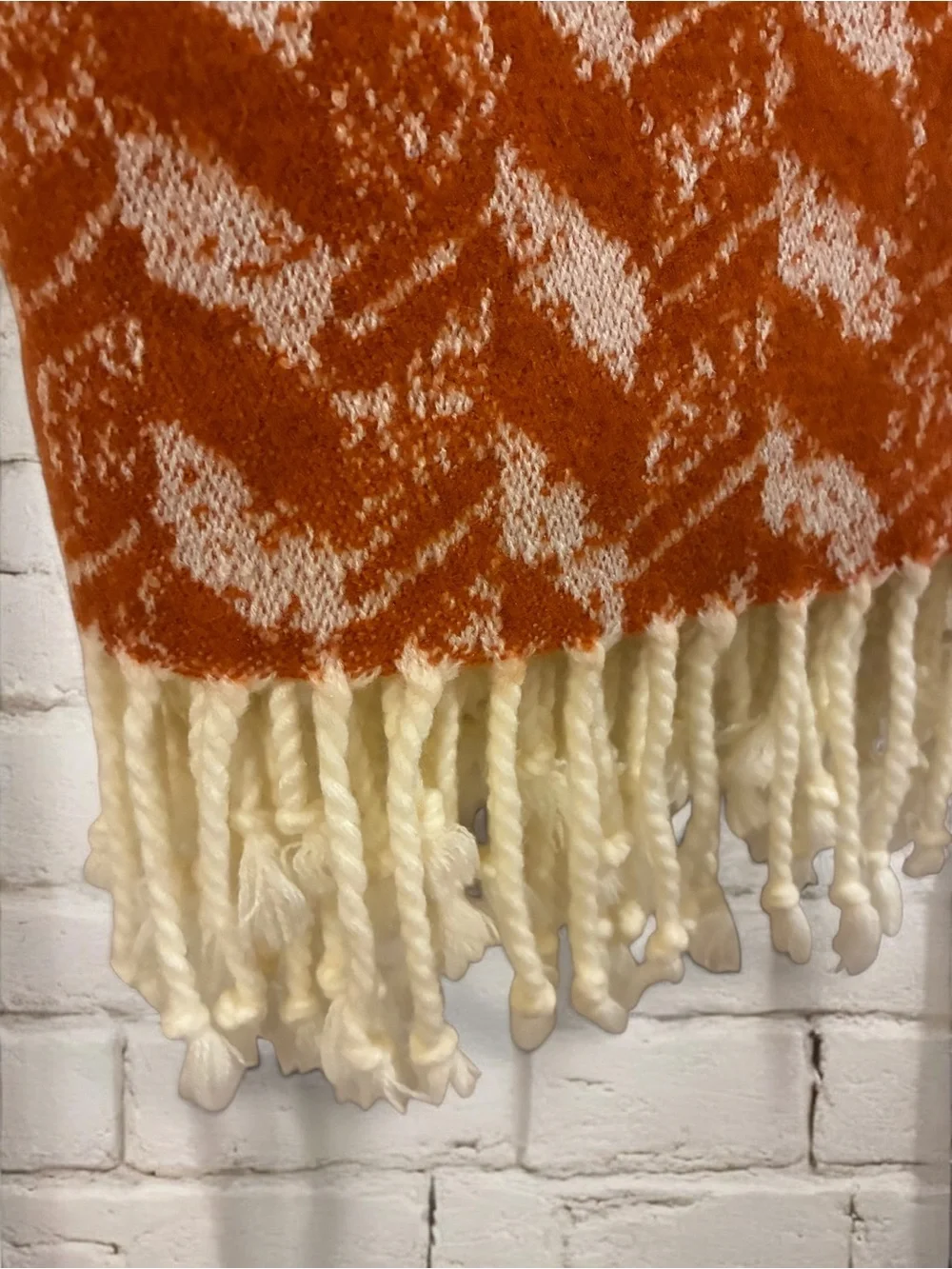 Threshold soft woven throw with knotted tassels. 60”x50”.